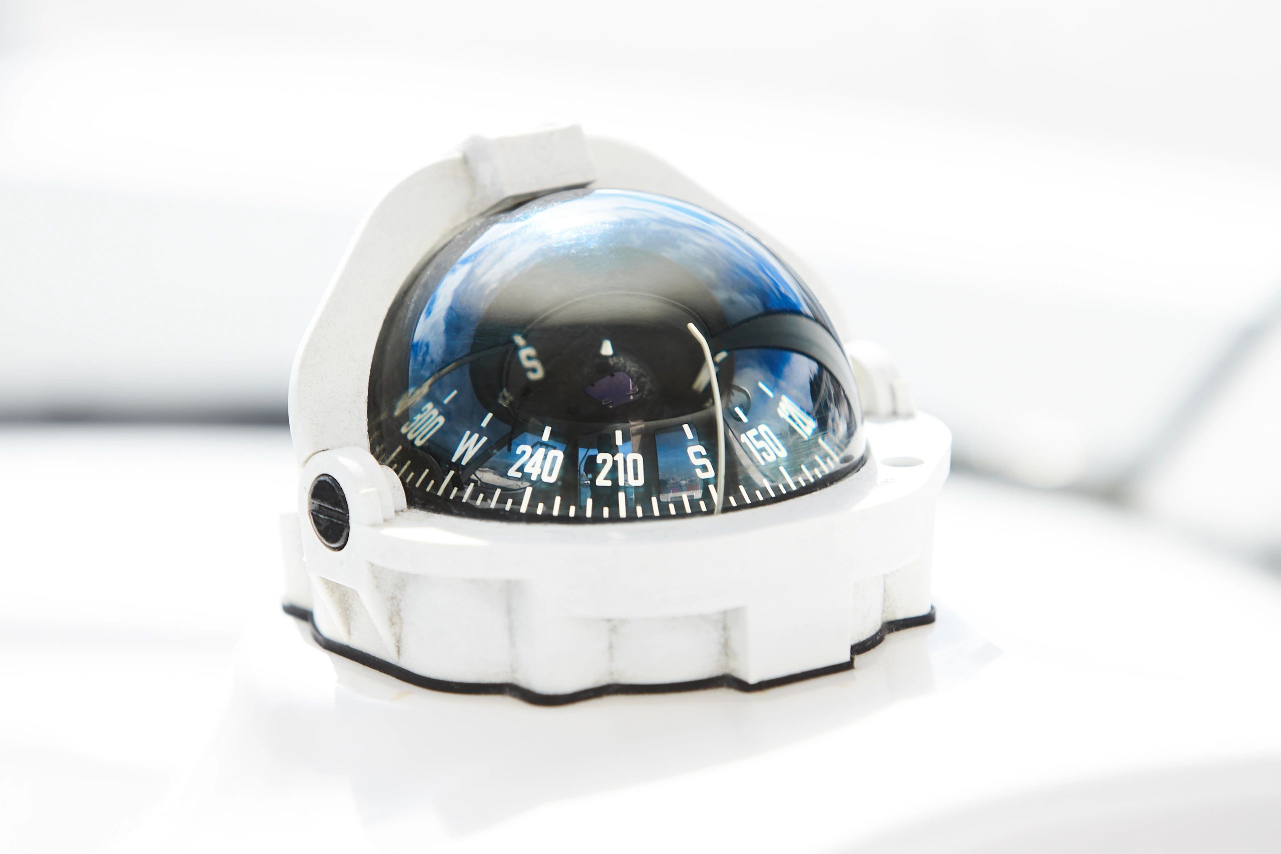 Boat compass detail symbolizing guidance and direction in marine insurance
