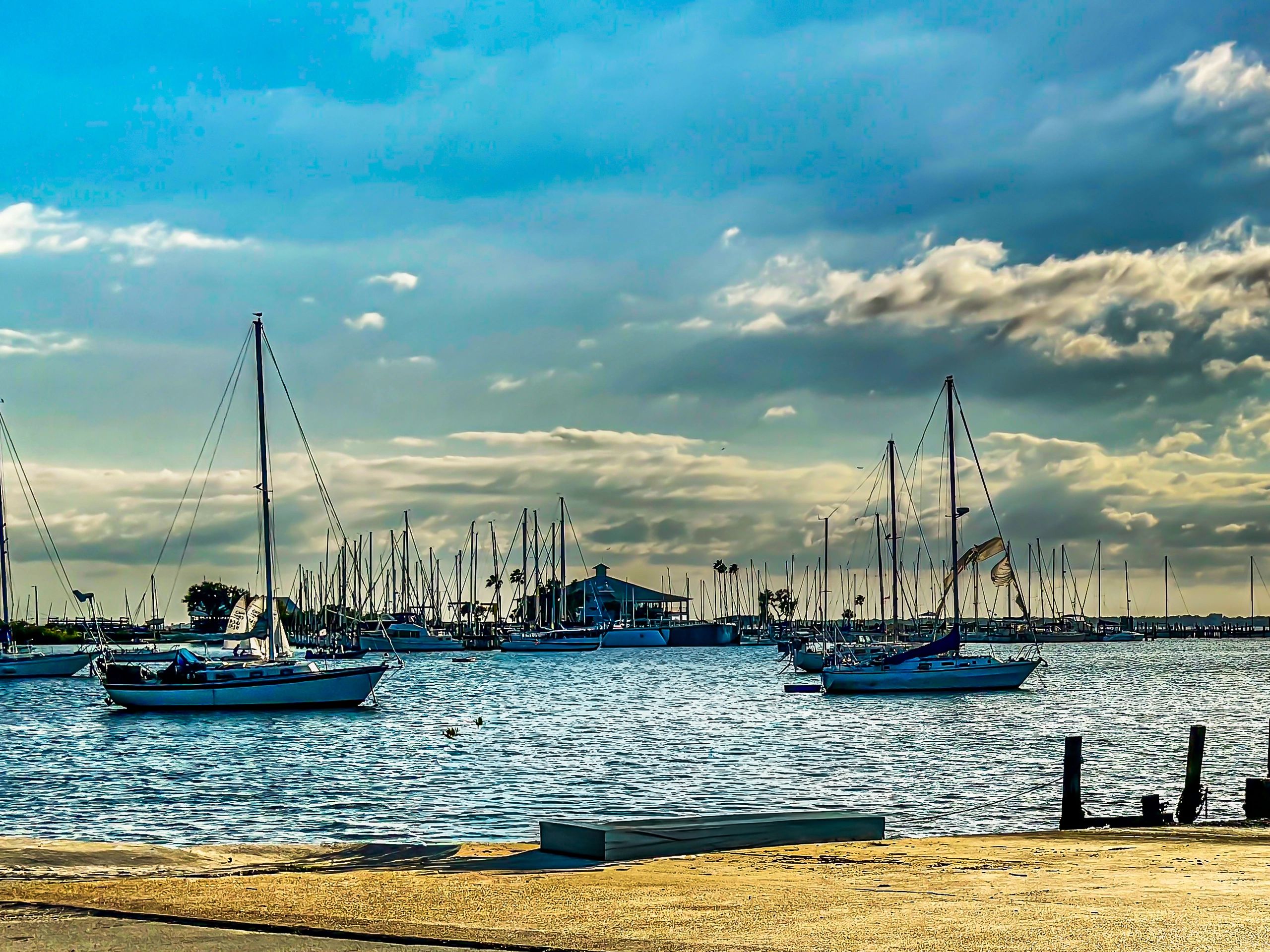 Dramatic sailboats in a marina representing specialty marine risk coverage