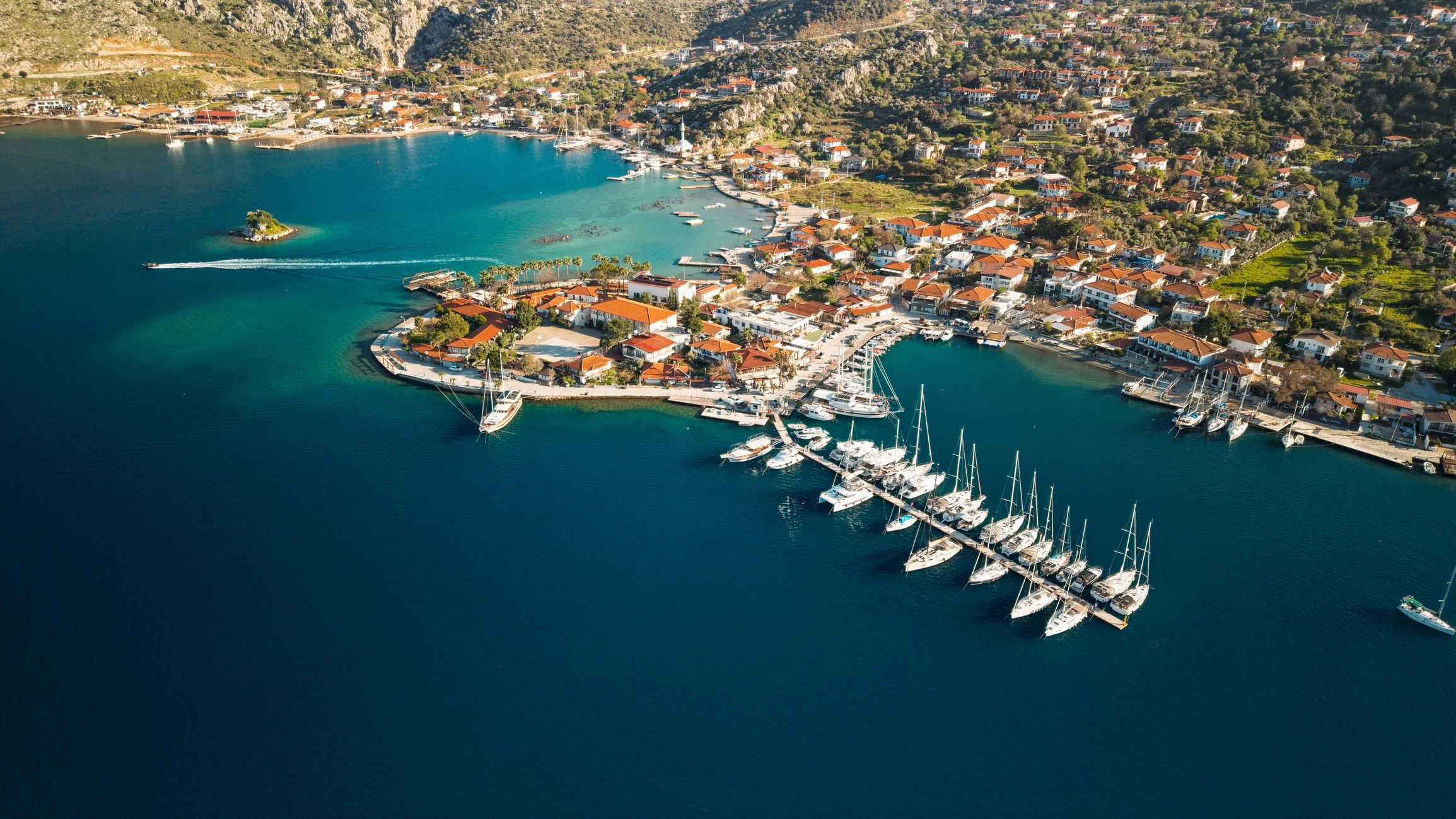 Coastal marina and turquoise water aerial view